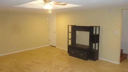 Finished, tiled basement w/ ceiling fan
