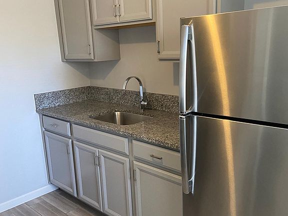 Stainless steel appliances, with tile floor