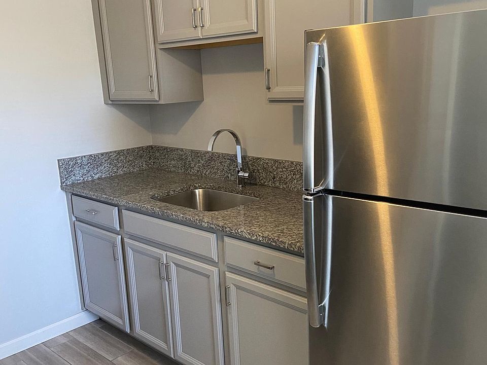 Stainless steel appliances, with tile floor