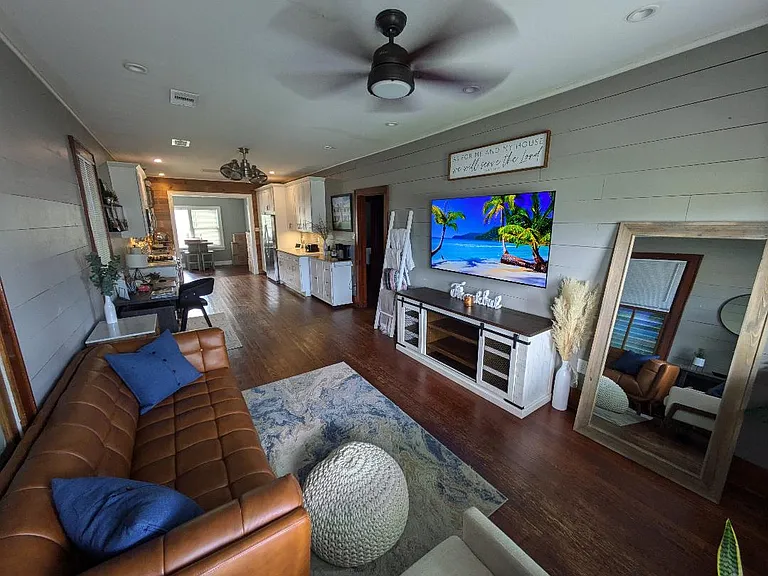 House is for rent unfurnished. Photo shows how previous tenant set up living room.