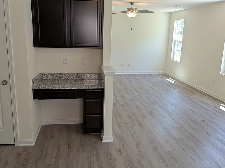 Dedicated workspace conveniently located off the kitchen, ideal for remote work, homework, or managing household tasks.