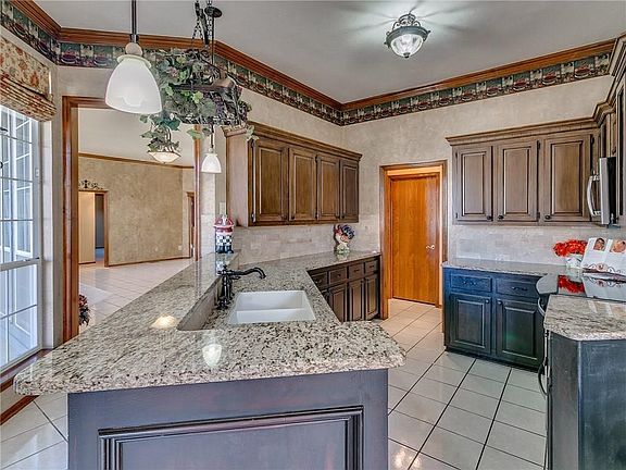 Another view of the kitchen with granite countertops.  It also has a wonderful stove with convection oven.