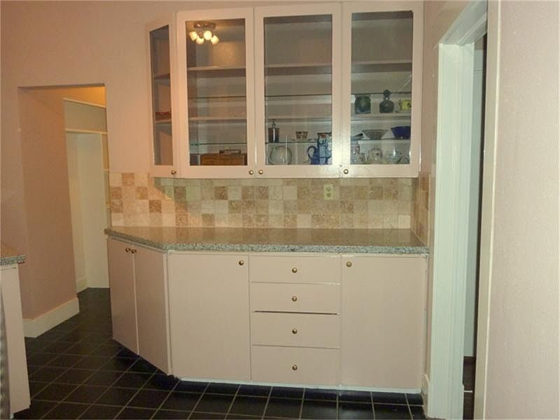Additional glass front cabinetry in the kitchen.