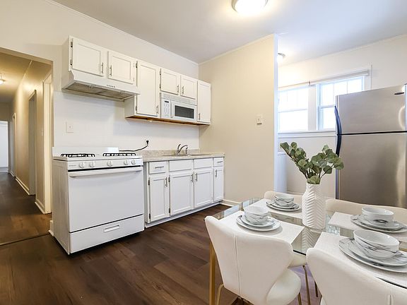 Eat-in Kitchen. Virtually staged to show how the kitchen could look.