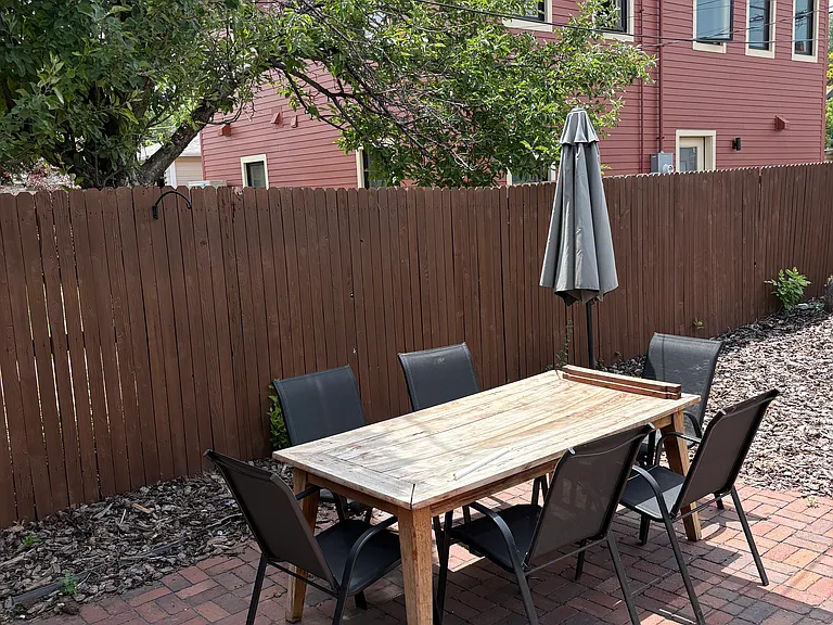 fully fenced back yard. dining table and chairs and patio furniture can stay if wanted.