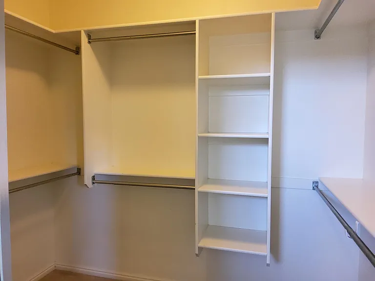Primary bedroom walk-in closet