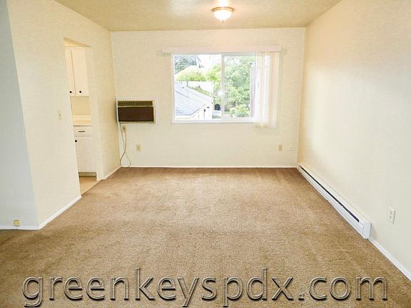 Living room showing in-wall air conditioner