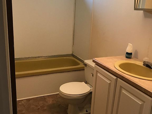 Nice size bathroom with additional room behind the door
