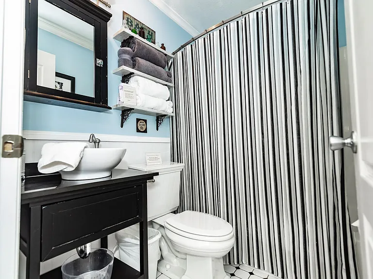 Hall bath with tub/shower.