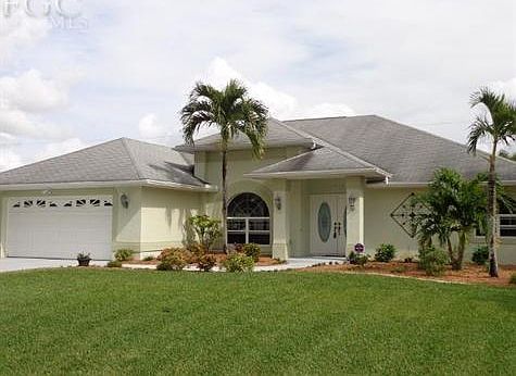 Front elevation.  Beautiful lawn with Floritam sod and irrigation system on City water (all assessments PAID in full).