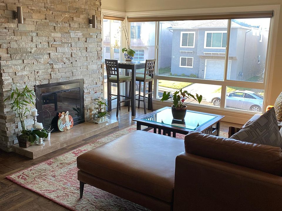 Wood burning fireplace and main living room