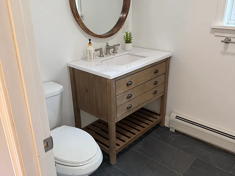 Primary en suite bathroom with shower and new vanity