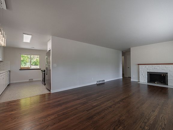Open floorplan with gorgeous hardwood floors and fireplace!
