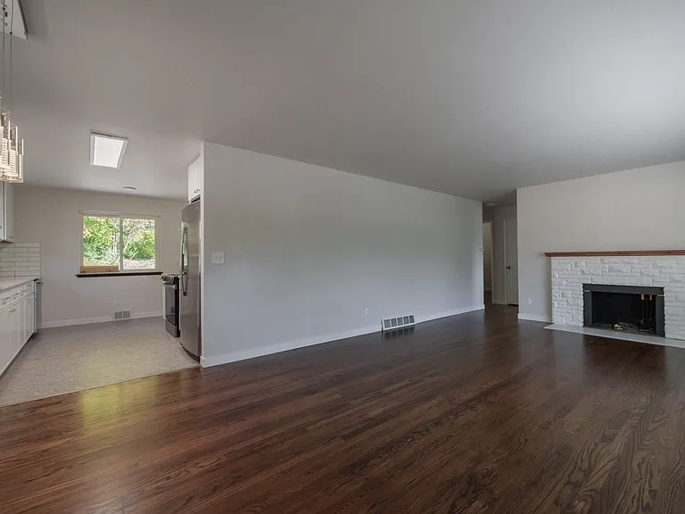 Open floorplan with gorgeous hardwood floors and fireplace!