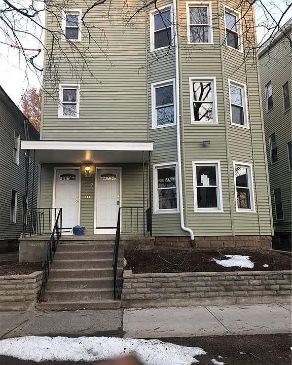 New siding on building. Front and rear entrances for units.