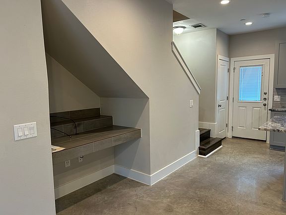 Great place for a computer set up. The door leads to the fenced yard