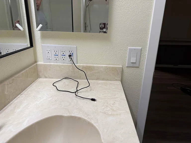 Bathrooms have a lot of outlets, including USB chargers