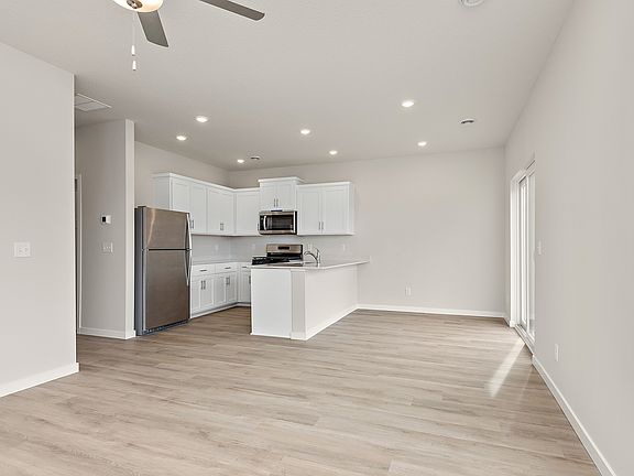 The kitchen is open to the dining room and family room.