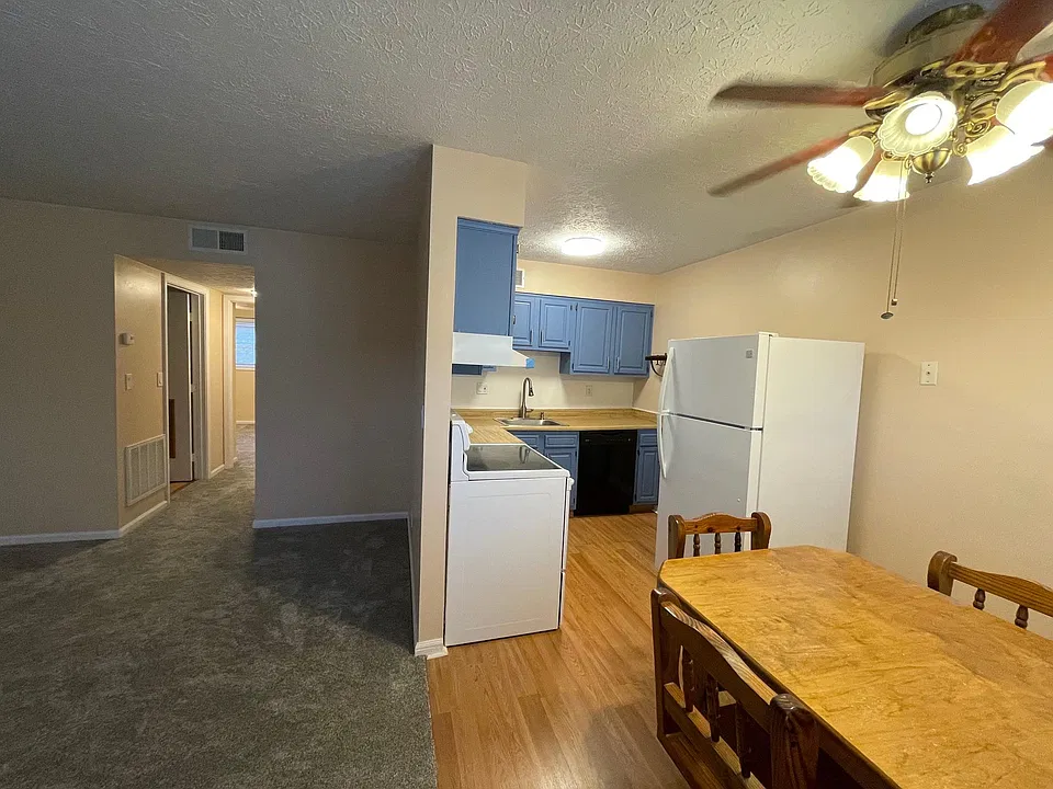Dining room, kitchen and living room (dining set not included).