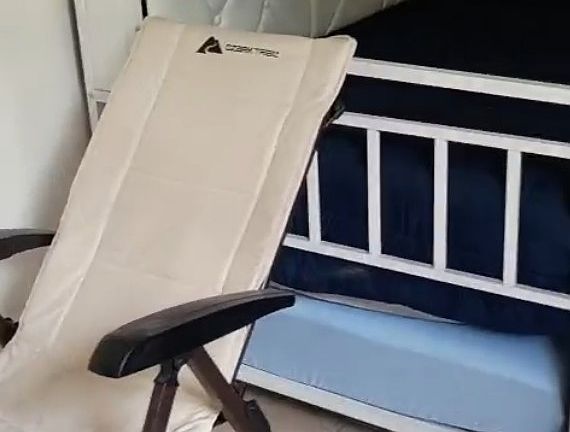 ENTRANCE TO THE RIGHT LOUNGE CHAIR IN FRONT OF DAYBED