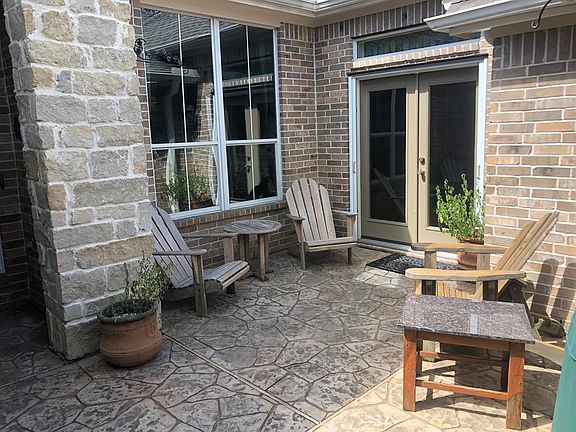 Wonderful gated front porch sitting area!