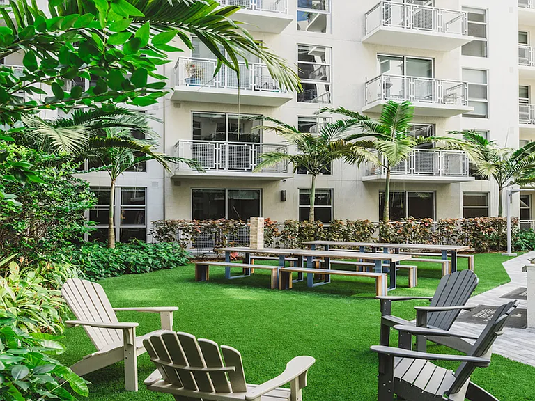 Serene courtyard with grilling stations and dining areas
