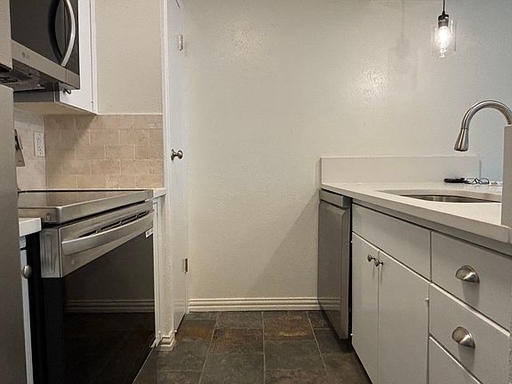 Brand new appliances and freshly pained kitchen cabinets