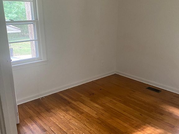 Nice hardwood floors in bedroom, living and office .