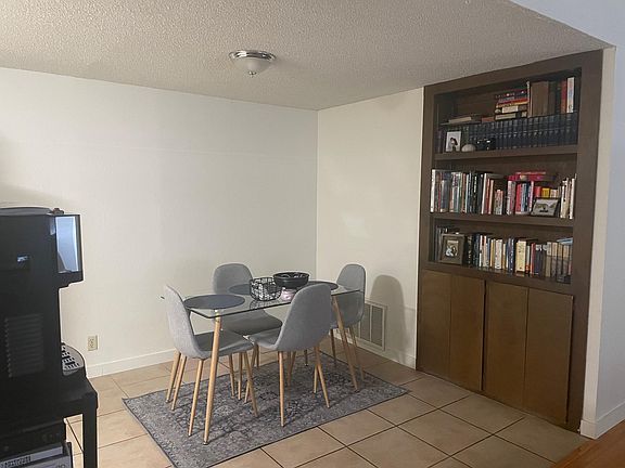 Tile floor. Built-in storage