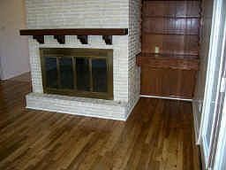 Den with WBFP, Oak floors