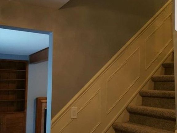 Staircase to 4 bedrooms on upper level