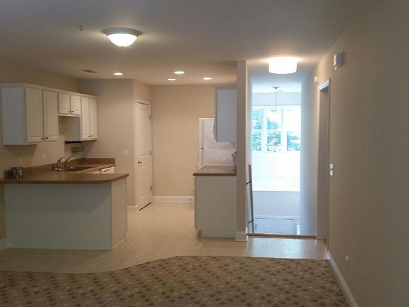 View of kitchen and stairway entrance