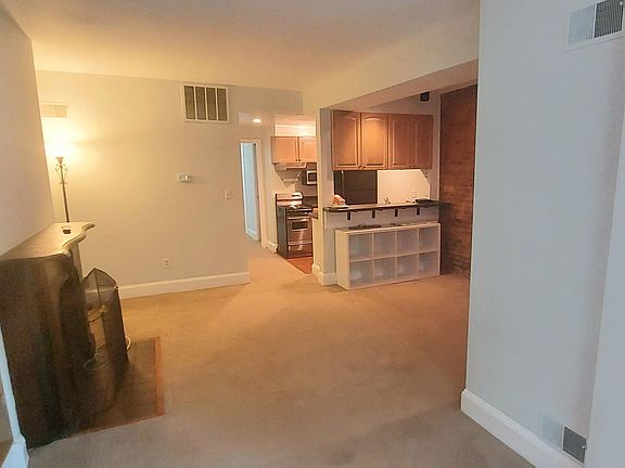 Long view of the apartment. from front thru kitchen towards rear.