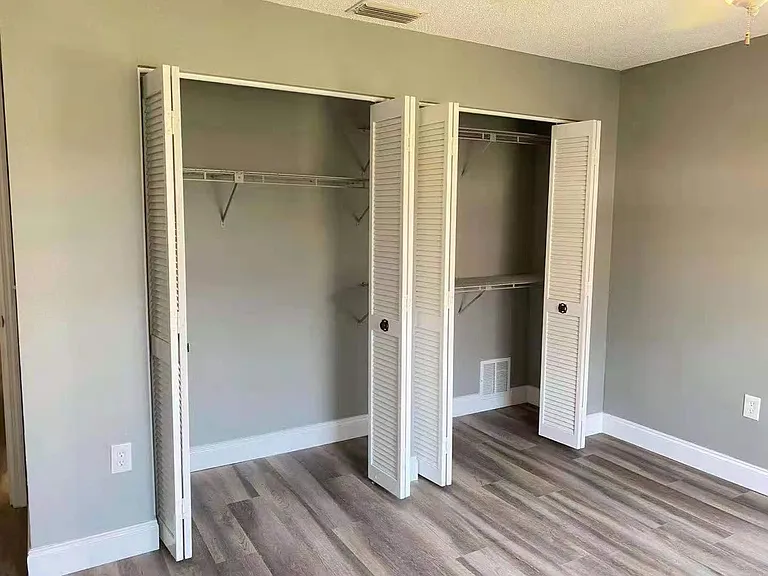 bedroom 2, showing closet space with shelves