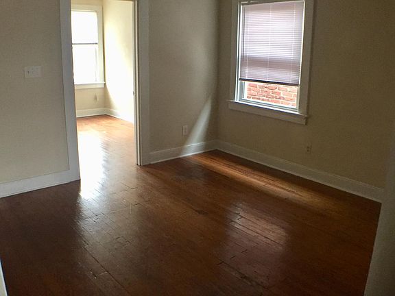 Living room and door to front bedroom