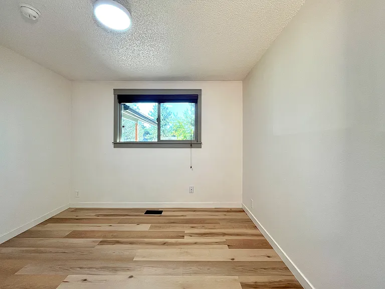 Third bedroom with view to the front yard.