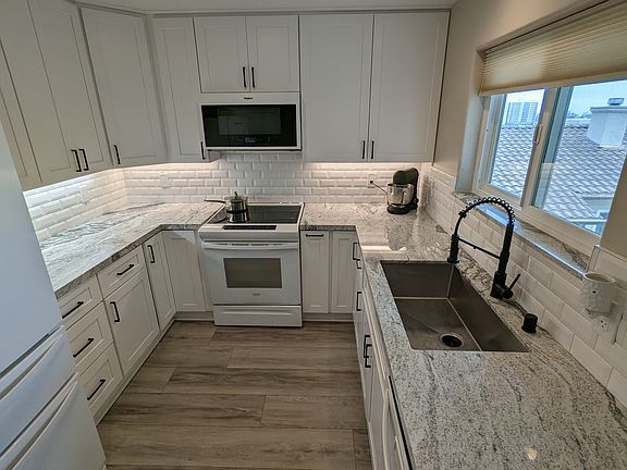Kitchen cabinets built to ceiling.