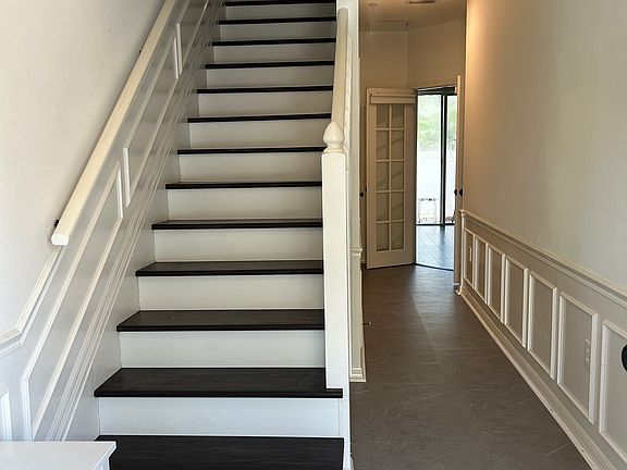 front entrance with half bath on hallway