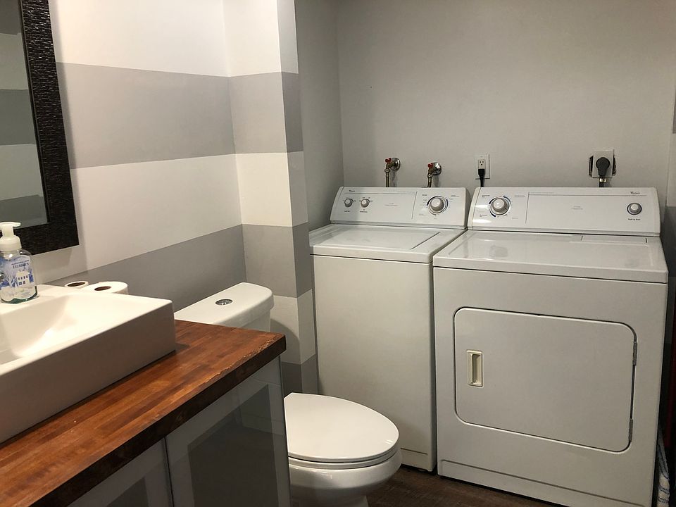 Washer/Dryer with half bathroom downstairs.