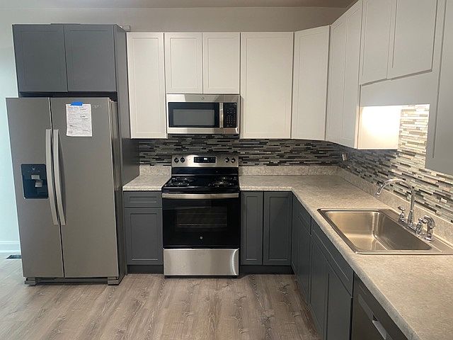 Large new EAT IN kitchen with brand new stove, refrigerator and dishwasher