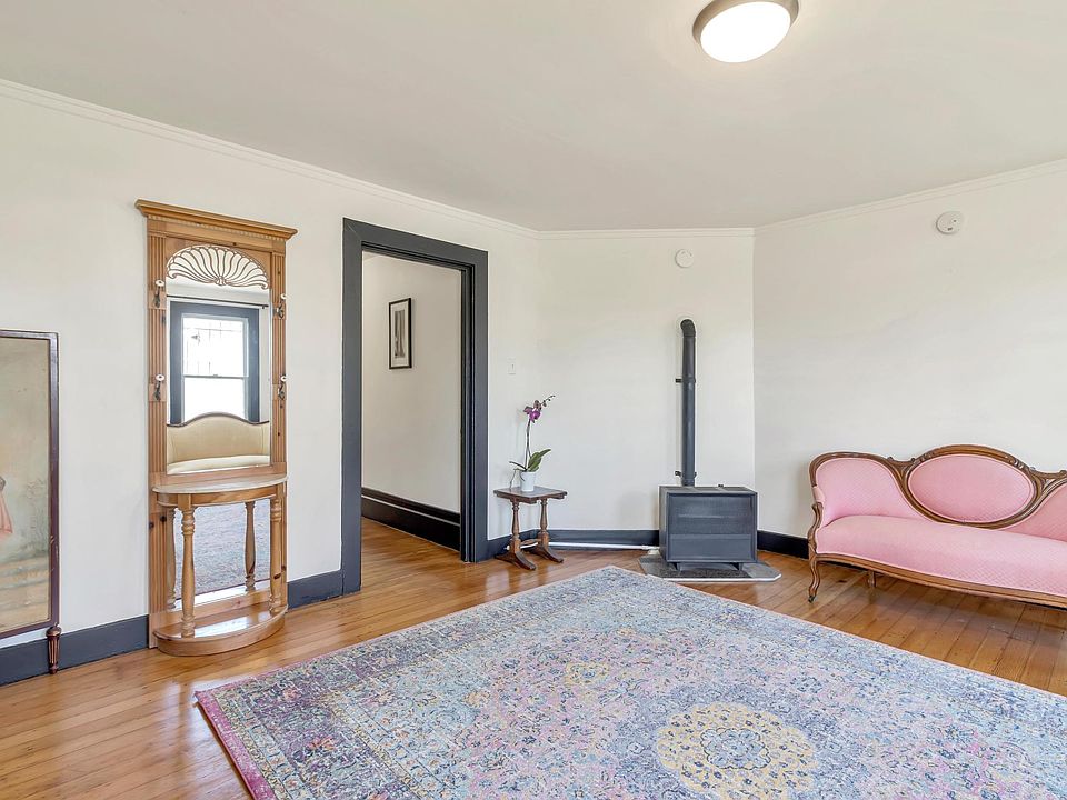 Living room. Refinished original oak floors. Gas wall heater. Sunny and bright with tons of natural light. Fresh paint.