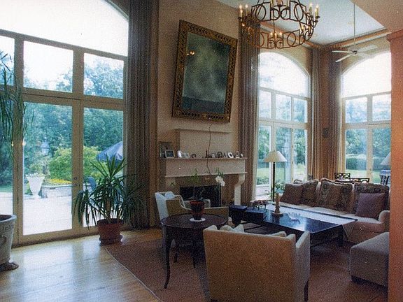 Floor to Ceiling Windows & French Doors Leading to Back Yard in Great Room