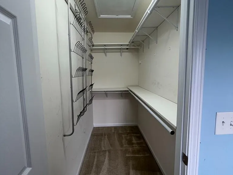 A walk in closet in the master with shelves included