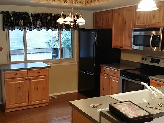 Kitchen, newer fridge has been installed.