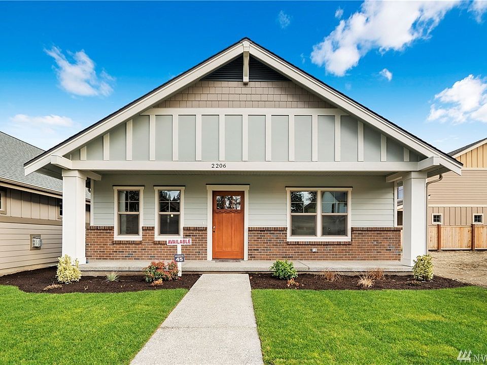 Craftsman style curb appeal with beautiful brick accent
