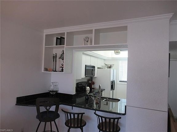 Pass thru with extended top and storage