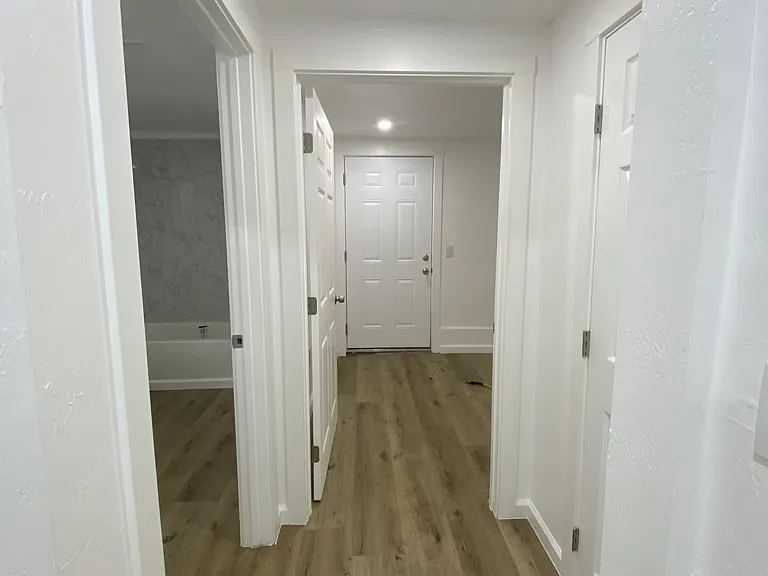 Hallway to bathroom and 3rd bedroom