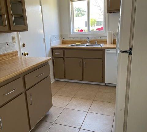 Kitchen with tile floor.