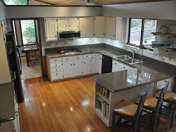 Main level kitchen with cathedral ceilings and skylight