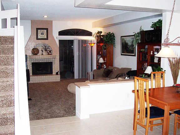Living room with working fireplace and patio.